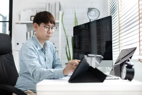 Professional development programmers are using tablet to test the functionali Stock-Fotos