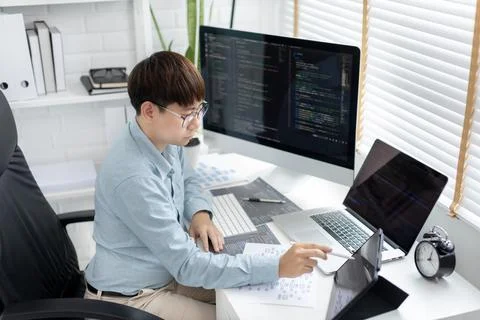 Professional development programmers are using tablet to test the functionali Stock-Fotos