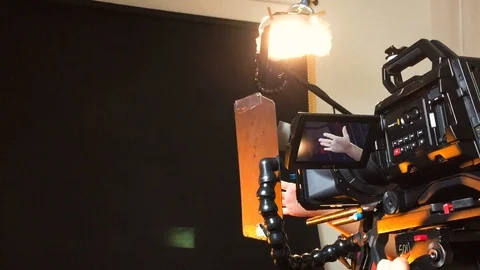 Professional digital camera on a tripod during shooting, tv set Stock Footage 103660872