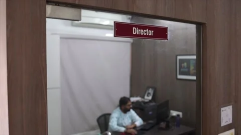 Professional Director Office View Through Glass Door with Executive Working at Stock Footage 333605454