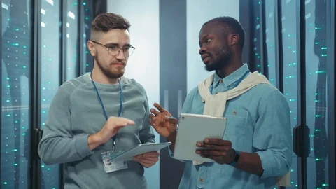 Professional diverse team of server engineers coworking with technology at data Stock-Footage 119787129