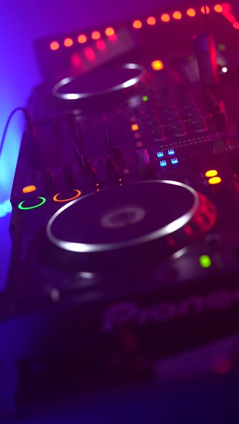 Professional dj controller mixing music at a nightclub party Stock Footage 333562892