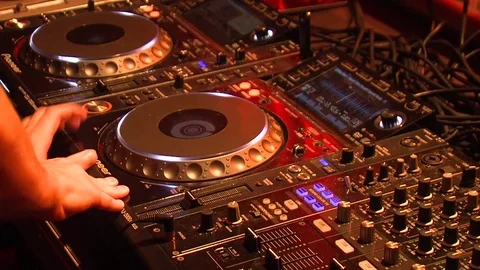 Professional Dj Makes Moves With Hands and mixing music  In Nightclub. Stock Footage 70503510