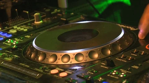 Professional Dj Makes Moves With Hands mixing music, tweaking controls Stockbeeldmateriaal 70513486