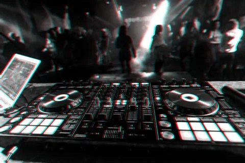 Professional DJ mixer controller for mixing music in a nightclub Stock Photos