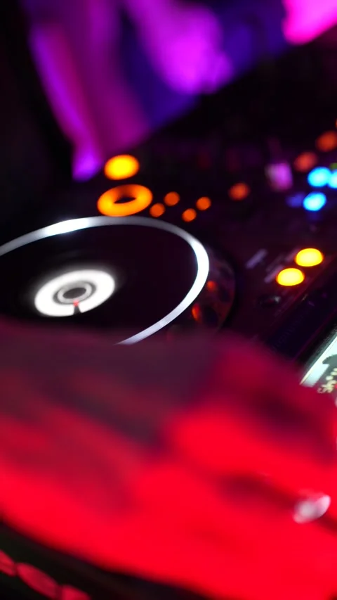 Professional dj mixing music on a controller at a nightclub party Stock Footage 325493062