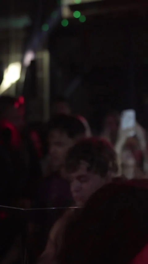 Professional DJ Performing Live Set in Dark Nightclub with Red Lighting Stock Footage 337902574
