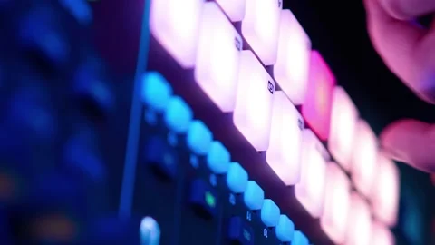 Professional DJ Plays Beat Sampler with Color Drum Pads and Samples in Studio Stock Footage 203931180