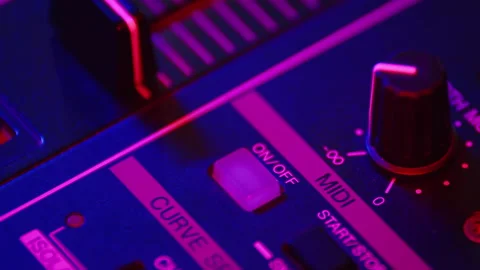 Professional DJ presses on and off button on fader in digital music console in Stock Footage 170320504