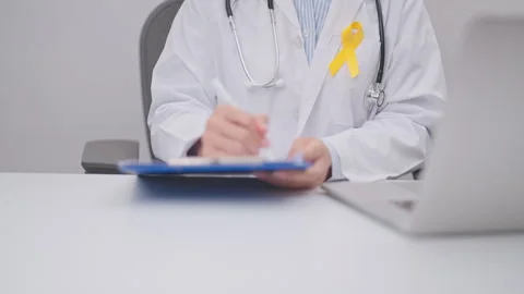 Professional doctor using laptop and taking report notes on notebook for Ye.. Stock Footage 337607796