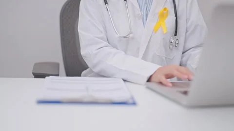 Professional doctor using laptop and taking report notes on notebook for Ye.. Stock Footage 337608109