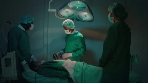 Professional doctors in the operating room making  CPR and use defibrillator  Stock-Footage 195209726