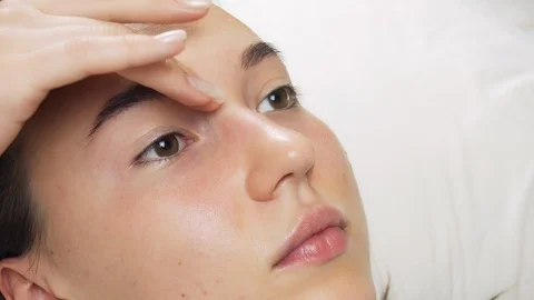 A professional does dyeing eyebrows with dyes, tinting. Video stock 121868579