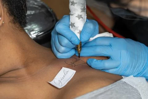 Professional doing a tattoo Stock Photos
