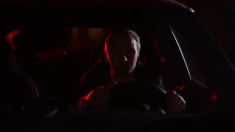 Professional driver in a night Stock Footage 211085067