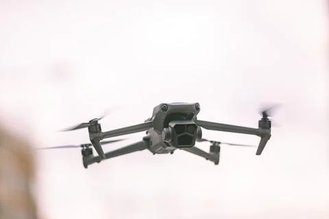 Professional drone with camera is hovering Stock Photos