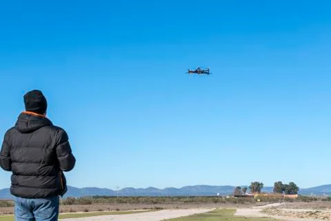 Professional drone flying over the airfield Stock Photos