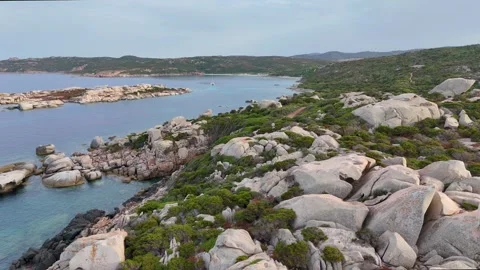 Professional Drone Lateral Shot Lighthouse and Rocky Coast Sardegna Gold Stock Footage 333634987