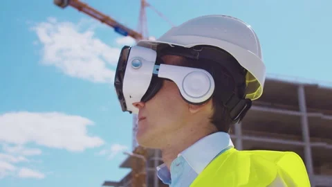 Professional drone operator in virtual reality helmet standing in front of Stock Footage 137772356