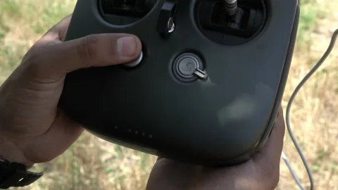 Professional drone pilot or stock photographer prepares a Drone for Flight. Stock Footage 139487277