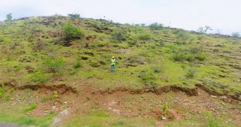 Professional drone pilot with safety hat recorded him self of returning drone on Stock Footage 168293843