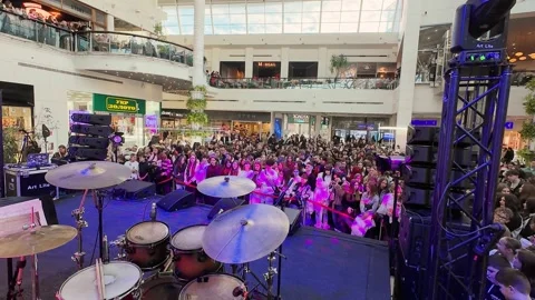 Professional drum kit and vocal microphones set up on an empty stage. Stock Footage 329140308