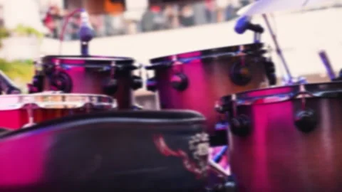 Professional drum kit and vocal microphones set up on an empty stage. Vídeo Stock 332131435