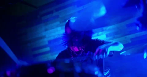 Professional Drummer emphatically playing the drums in twinkling strobe lights Stock Footage 221581503