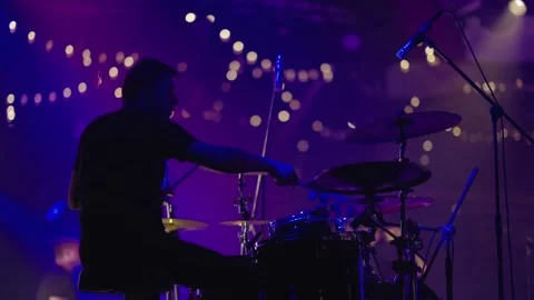 Professional drummer plays drum kit at concert. Shooting from back. Slow motion Stock Footage 243766168