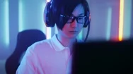 Professional East Asian Gamer Playing In Online Video Game On His Computer Stock Footage