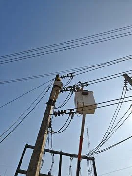 Professional electrical lineman worker technician in hydraulic bucket truck. Stock Photos