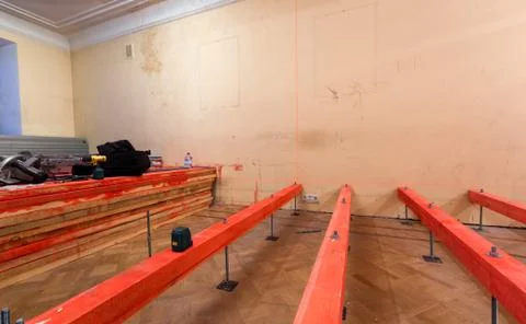 Professional Electronic Self Multi-line Laser Level and red painted wooden Stock Photos