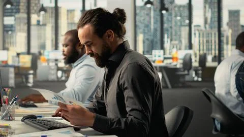 Professional employees analyzing data visualization and documentation Stock Photos