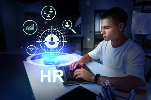 Professional engaging with human resources technology in a modern office Stock Photos