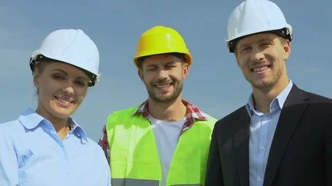 Professional engineer, architect and head builder in helmets smiling on camera 스톡 동영상 117195524