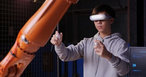 Professional Engineer is Controlling a Futuristic Robotic Arm. 스톡 동영상 126880330