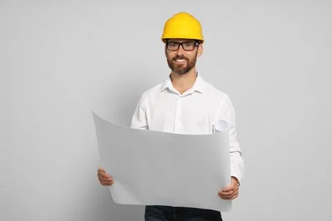 Professional engineer in hard hat with draft on white background Stock Photos