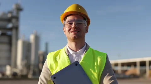 A professional engineer, a heavy industry worker, an inspector dressed in a Stock Footage 307354582