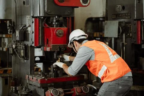Professional Engineer male worker clean service repair old heavy metal mach.. 写真素材