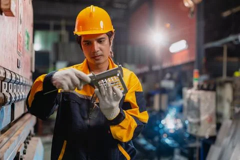 Professional Engineer male worker working check product quality measuring m.. Stock Photos