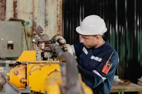 Professional engineer male worker working service inspecting robot machine,.. Stock Photos