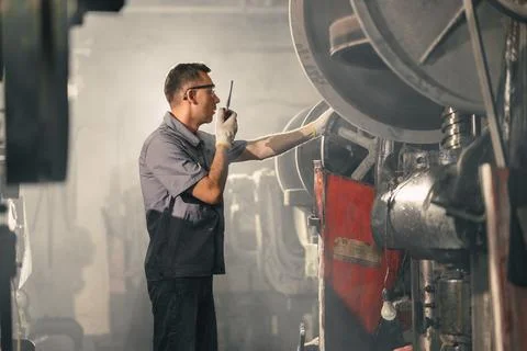 Professional Engineer man working in dust dirty air pollution industry. Wor.. Stock Photos