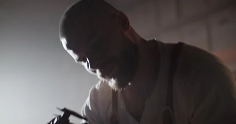 Professional engineer measuring part with calipers in dark workspace Stock Footage 259389421