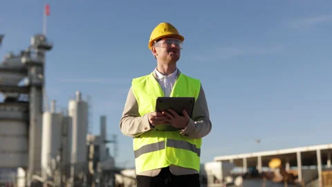 A professional engineer shows a class hand gesture, thumbs up., a heavy industry Stock Footage 229354611