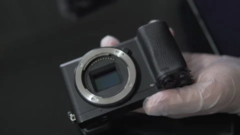 Professional engineer specialist checking photo camera sensor at workshop. Ph Stock Footage 270371860