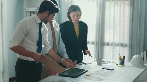 Professional engineer team talking about turbine engine structure. Alimentation. Stock Photos