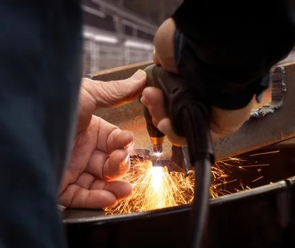 Professional engineer at work while cutting metal with torch 스톡 사진