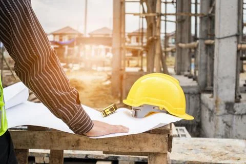 Professional engineer worker at the house building construction site Stock Photos