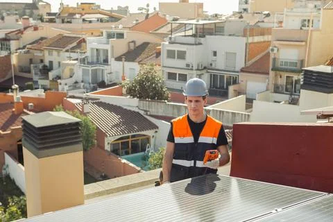 Professional engineer worker installing solar panels on a house roof Foto stock