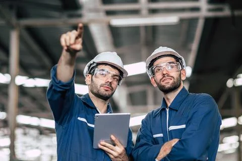 Professional engineer workers standing together looking forward with confid.. Foto stock